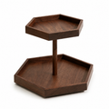 Solid black walnut two-tier rotating coffee display stand on white background