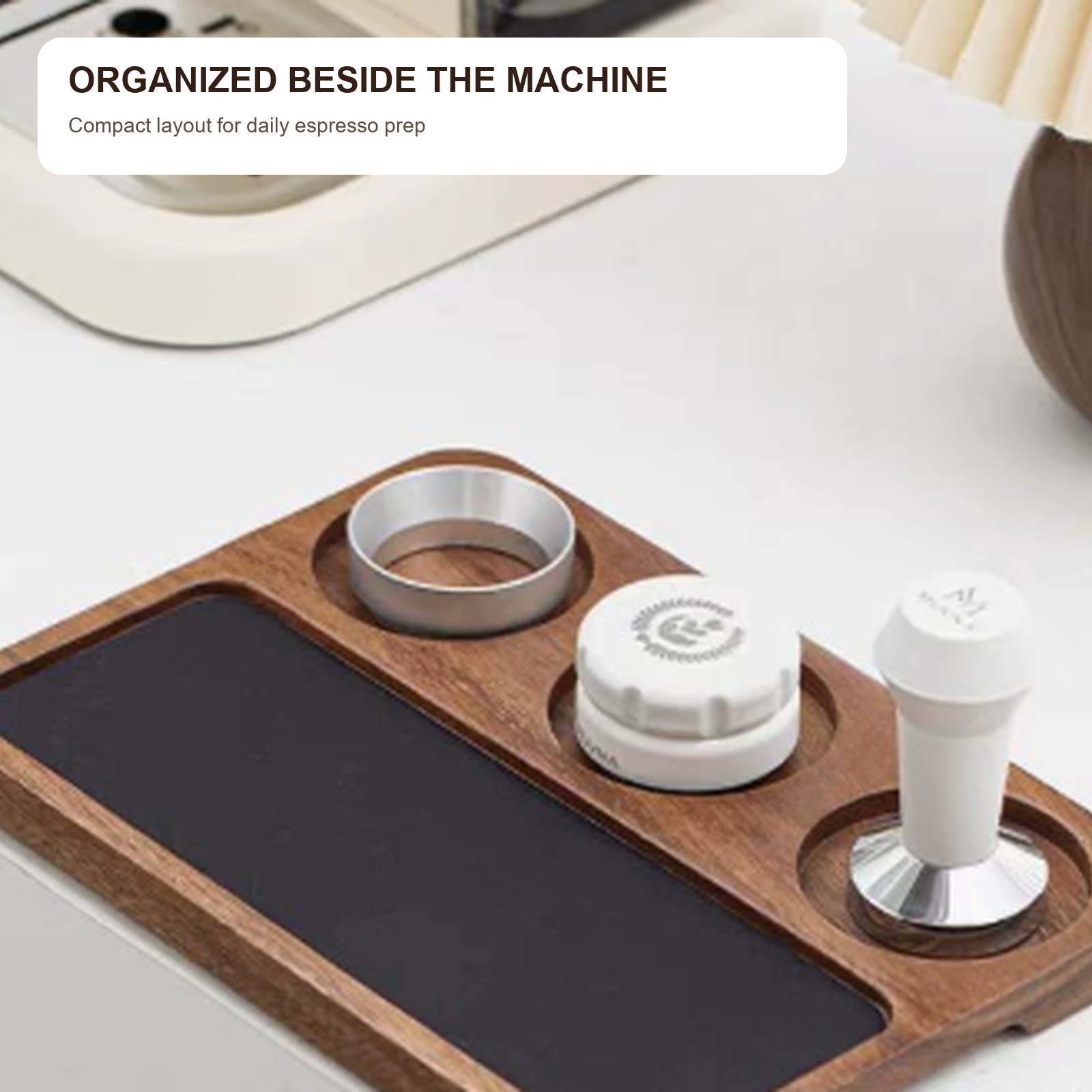 Espresso tool organizer board beside a coffee machine
