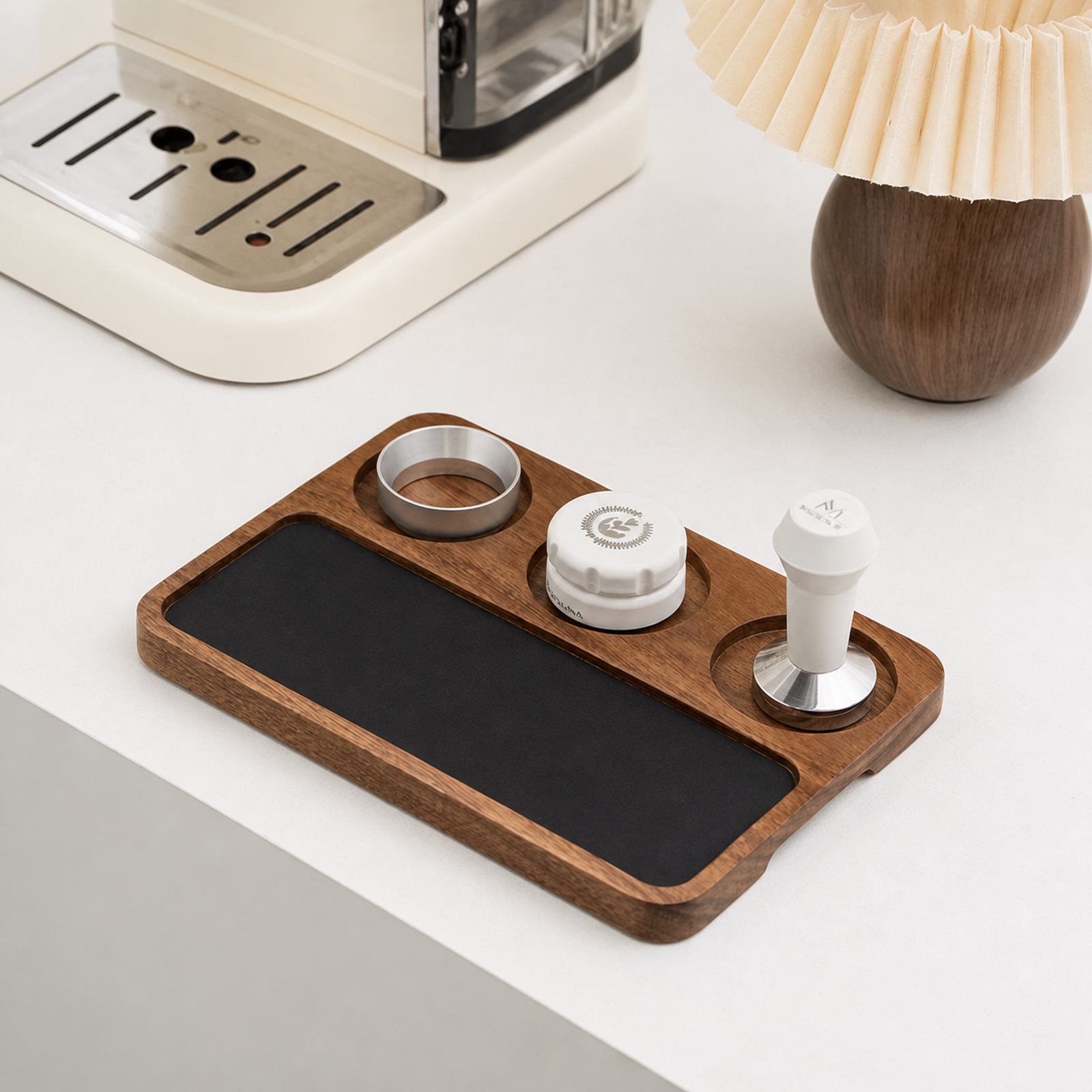 Solid walnut espresso preparation board beside a coffee machine