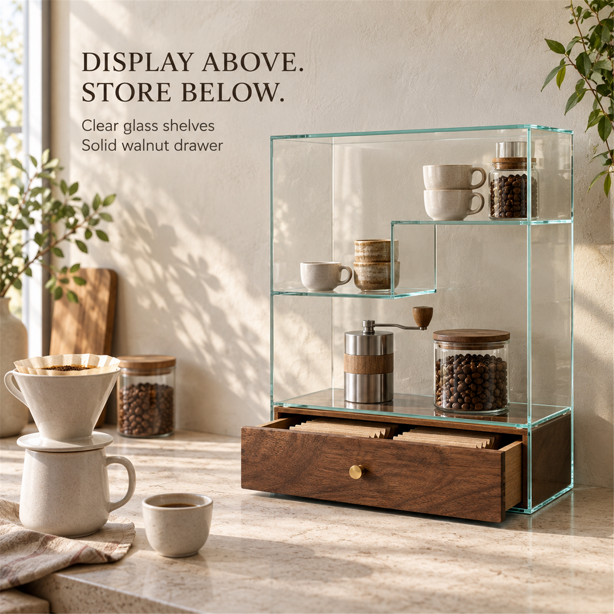 Coffee station scene showing clear glass display shelves above a solid walnut drawer holding filter packets