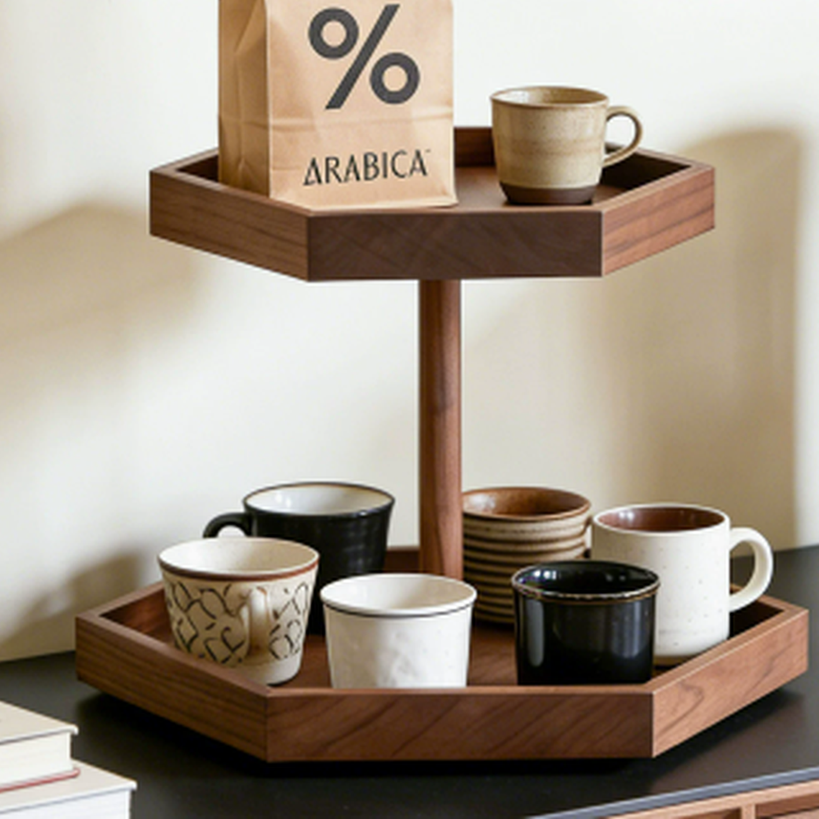 Two-tier black walnut coffee cup display on a coffee bar