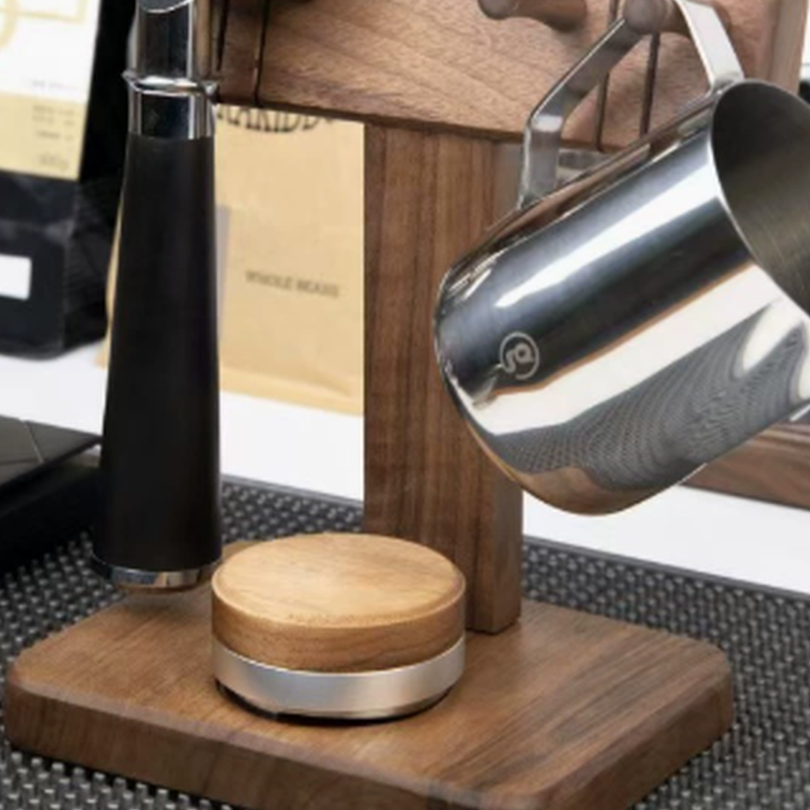 Walnut brown portafilter display stand in a coffee bar