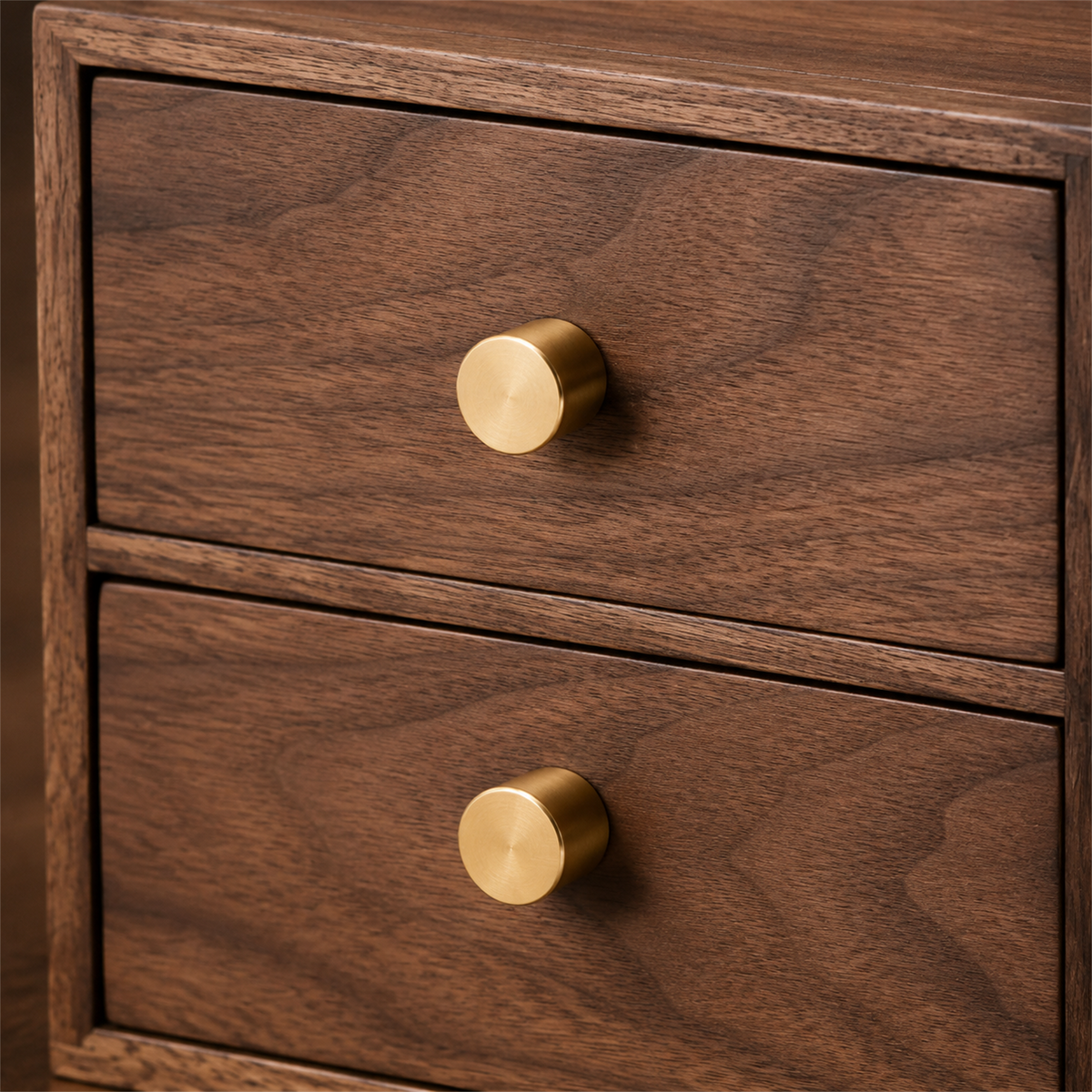 Brass knobs and natural black walnut grain detail