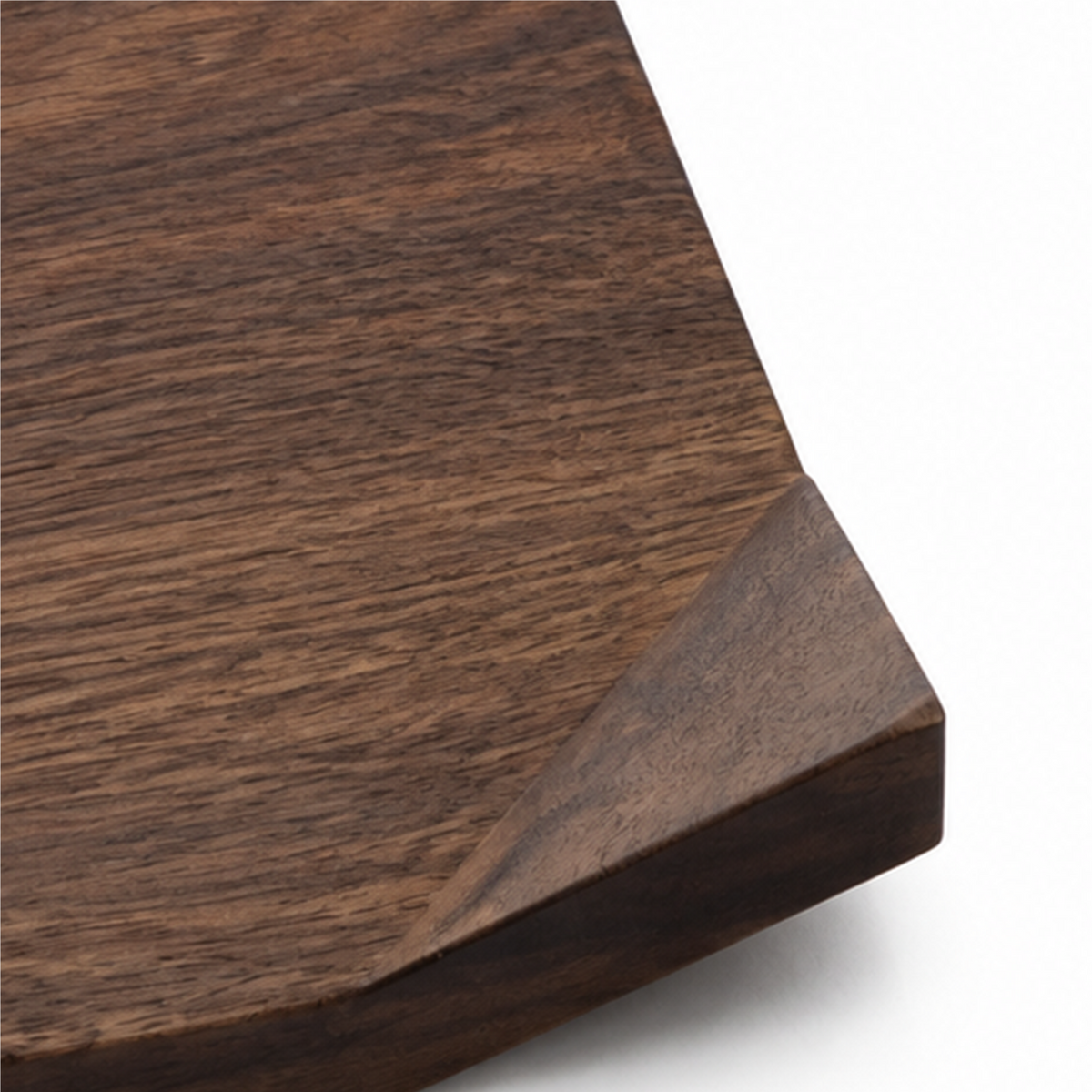 Raised folded corner and beveled edge detail on walnut serving board