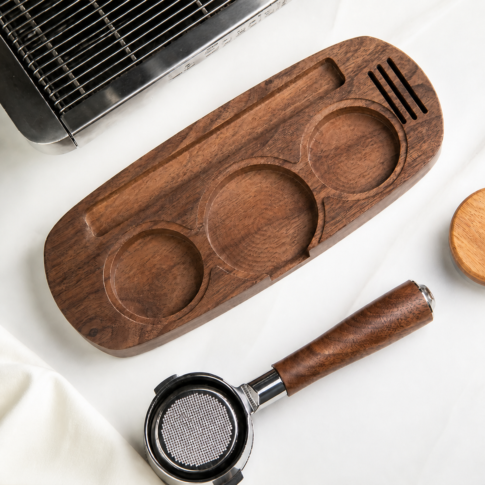 Solid walnut espresso tool organizer tray beside an espresso machine