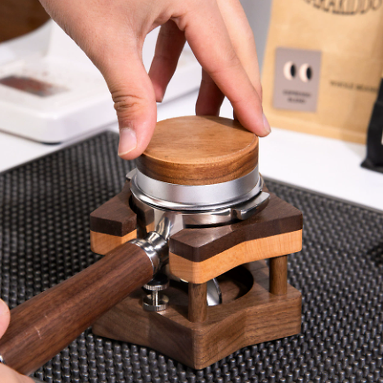 58 mm solid walnut espresso tamping stand supporting a portafilter
