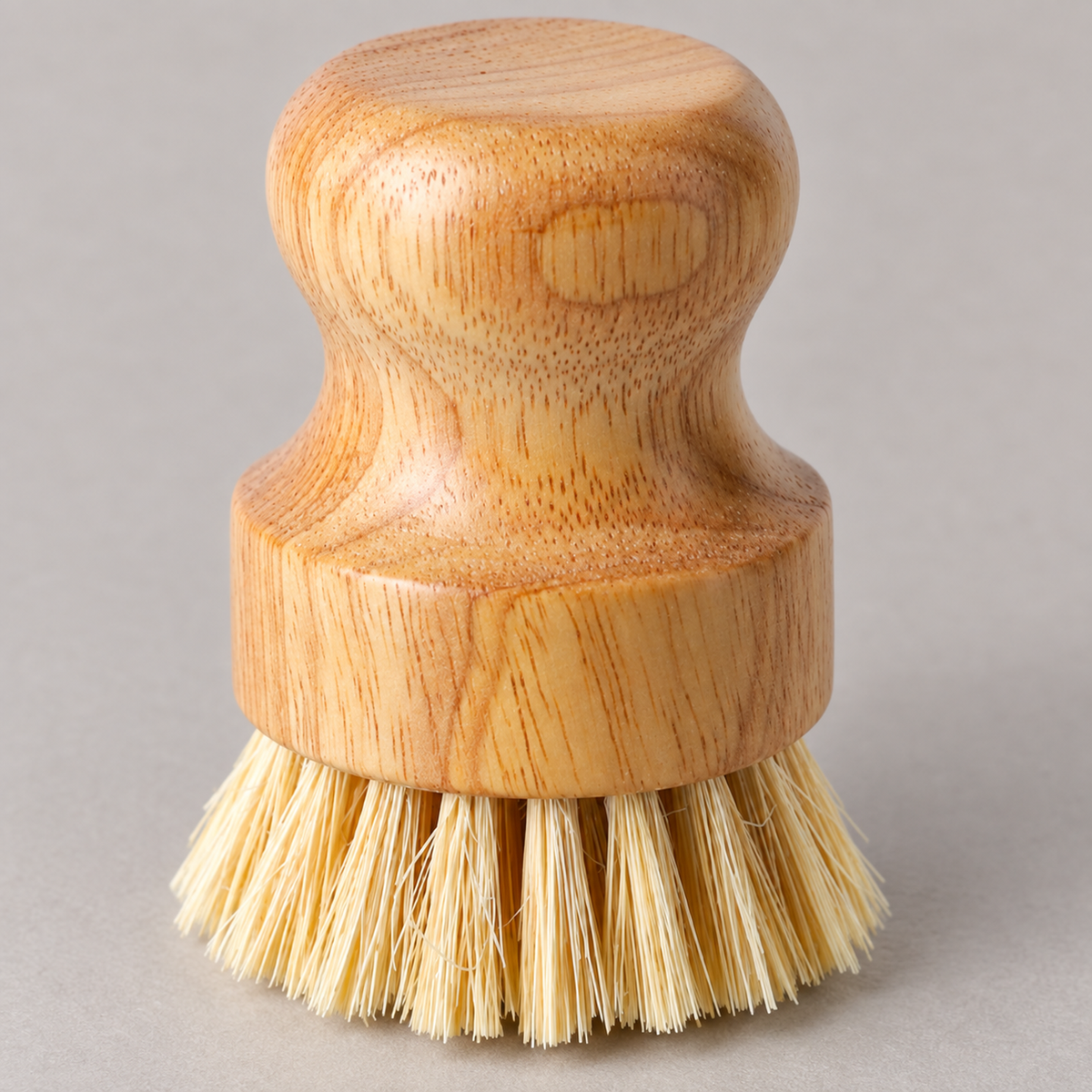 Close-up of the rounded solid wood palm grip and curved waist