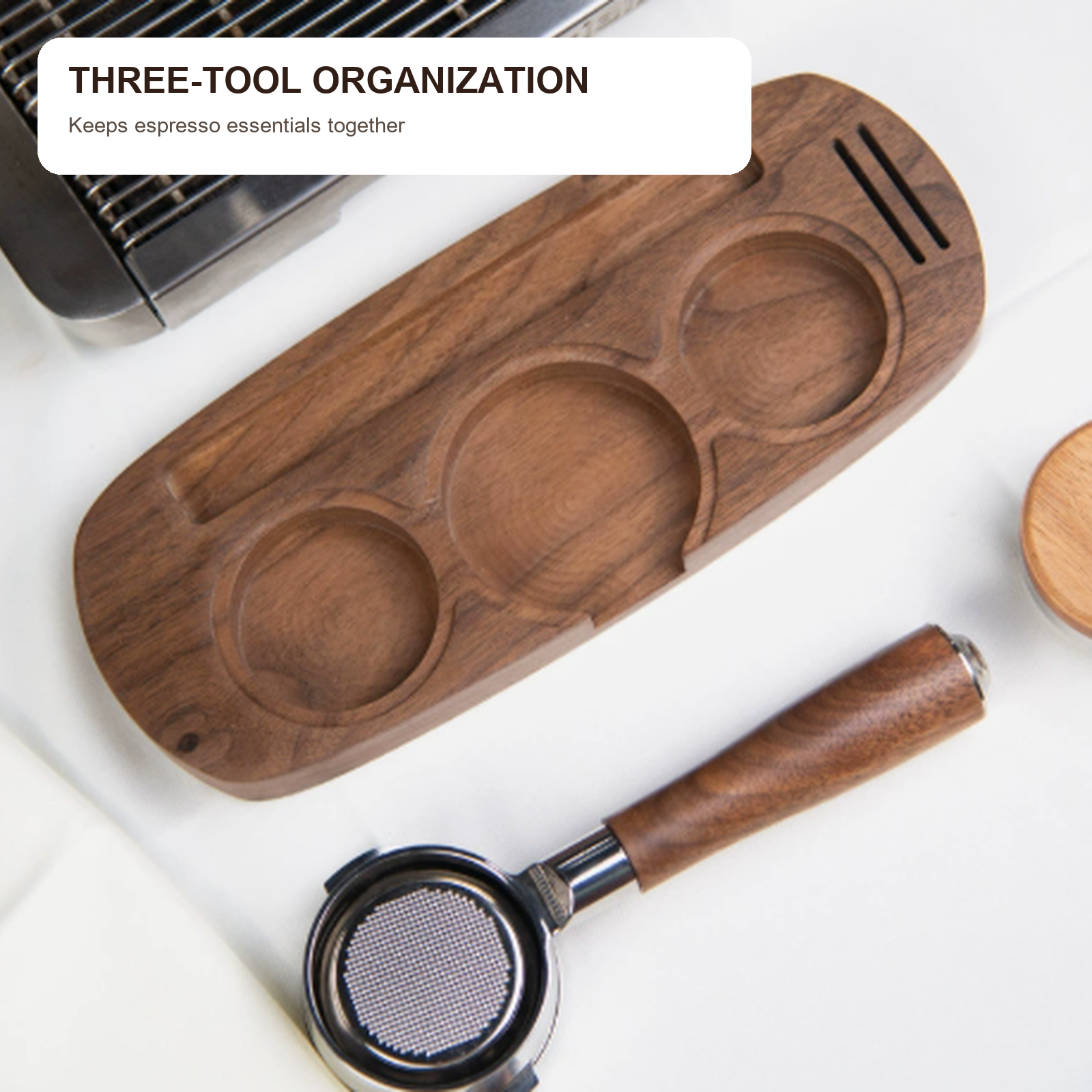 Three-well walnut espresso tool tray beside a coffee machine