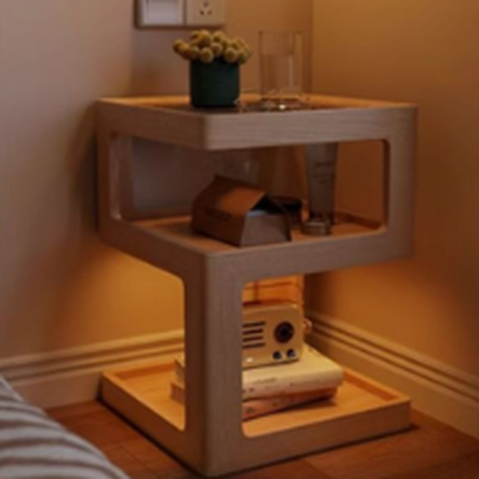 Natural finish three-tier coffee side table in a warm bedside setting