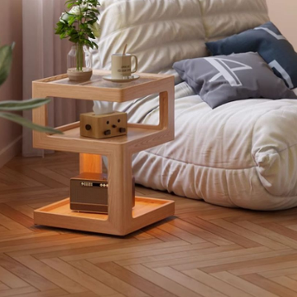 Natural finish three-tier coffee side table beside a lounge chair