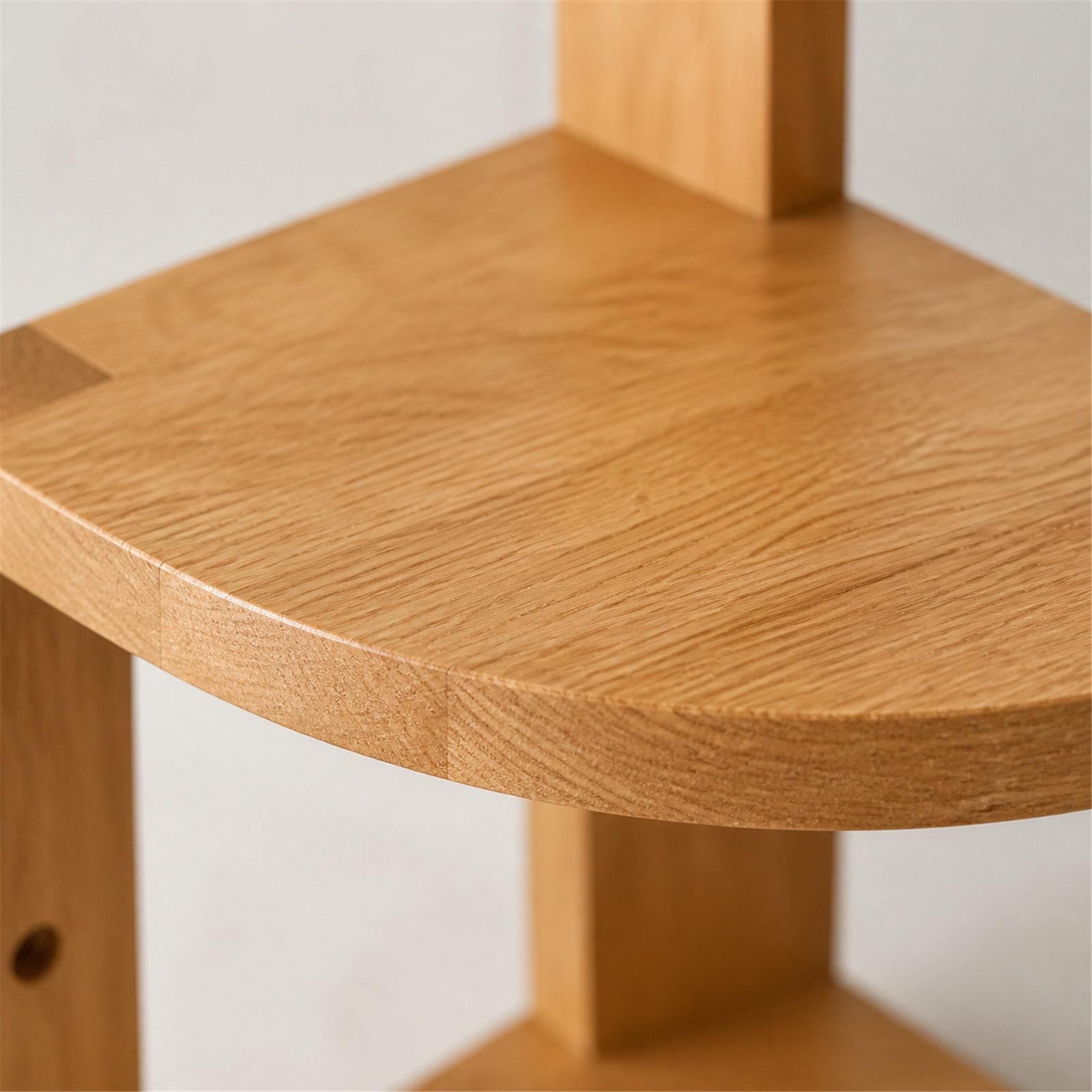 Natural rubberwood grain and curved shelf edge detail