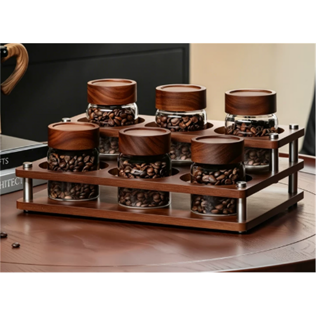 Six glass coffee canisters in a solid-wood organizer styled on a coffee table