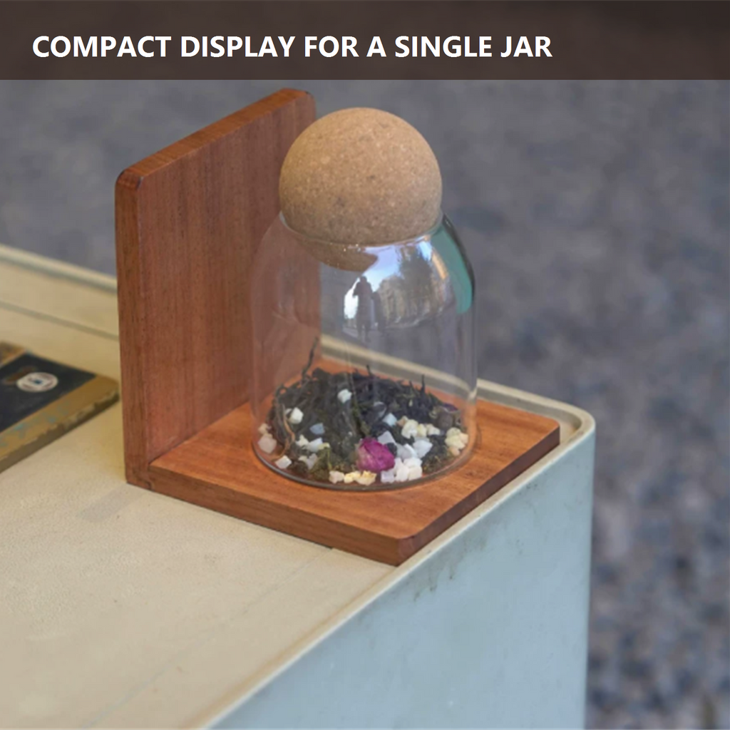 Compact solid wood shelf shown with one glass jar for scale