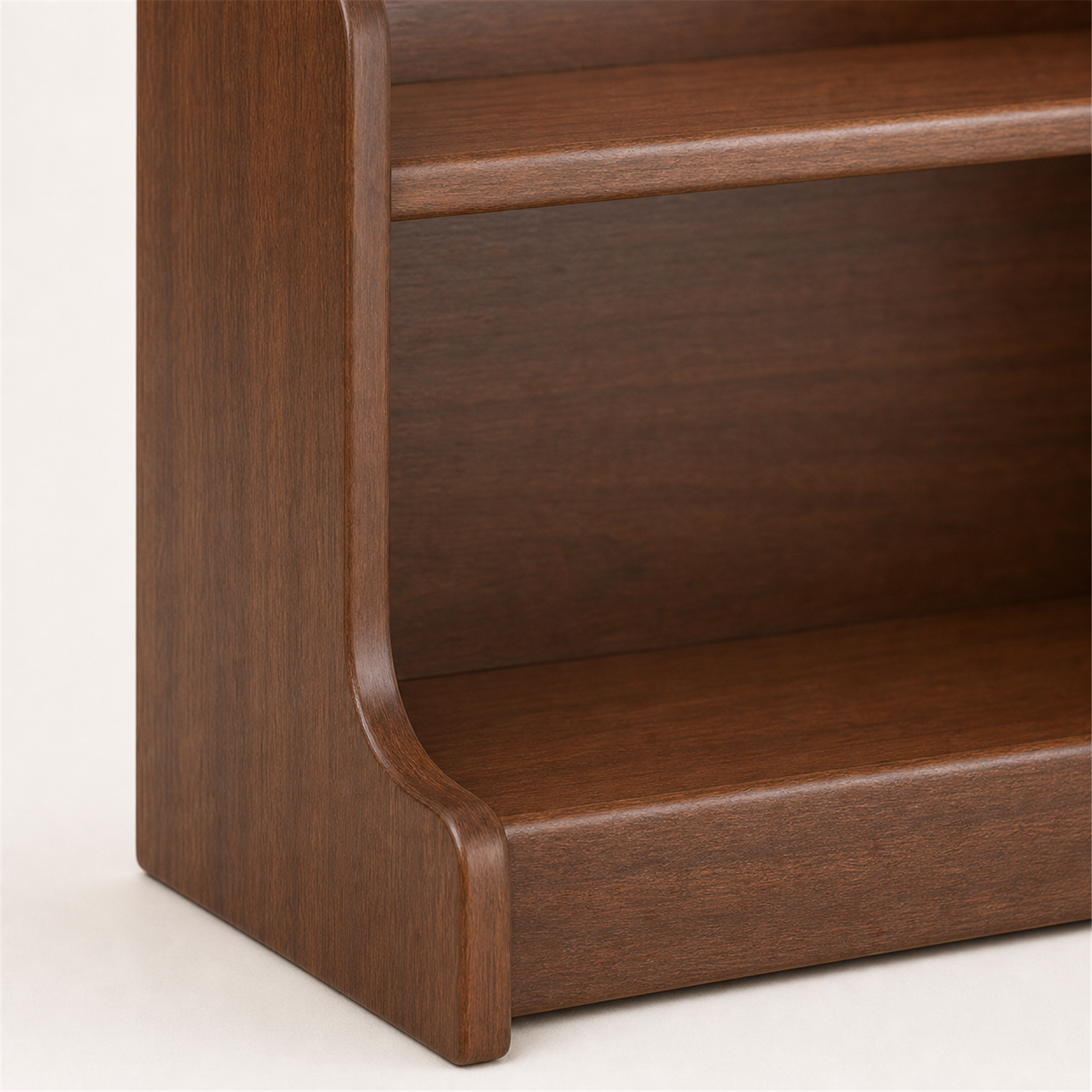 Close-up of rounded solid wood side panel and raised bottom rail