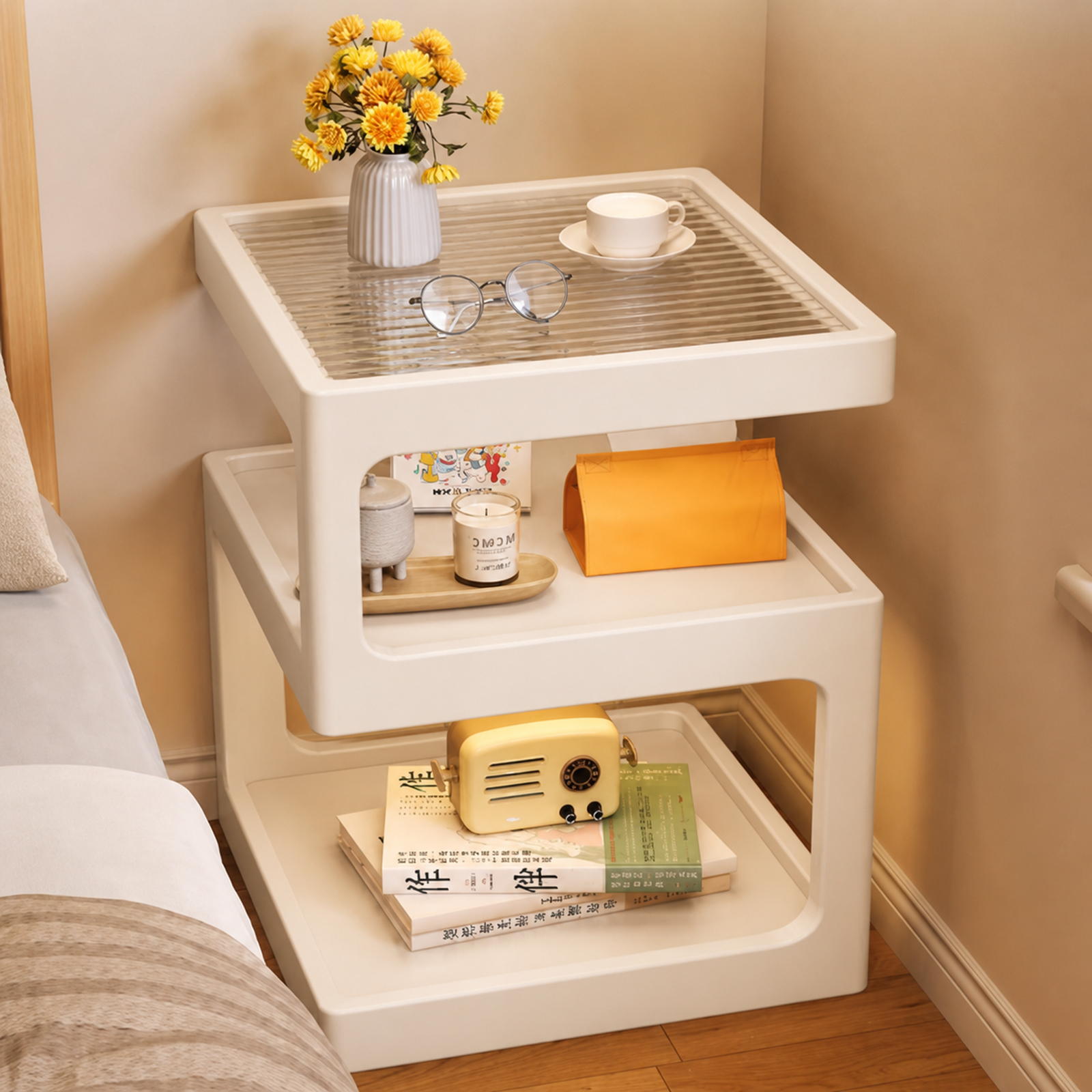 Warm white three-tier coffee side table beside a bed with alternating diagonal supports