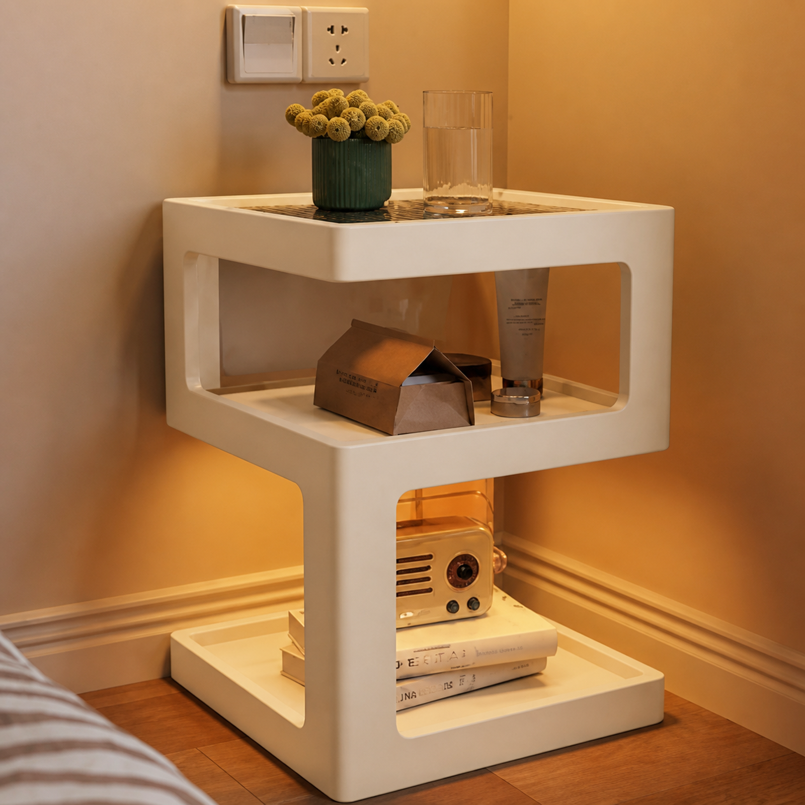 Warm white three-tier coffee side table in a warm bedside setting